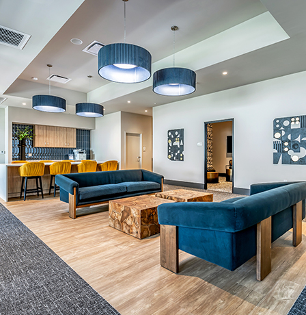 Aer community lounge with plush seating and community coffee bar.